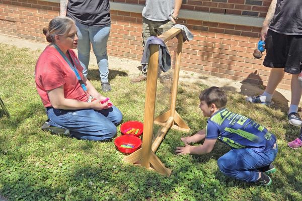 teacher and student participating outdoors in Emotions Art Day